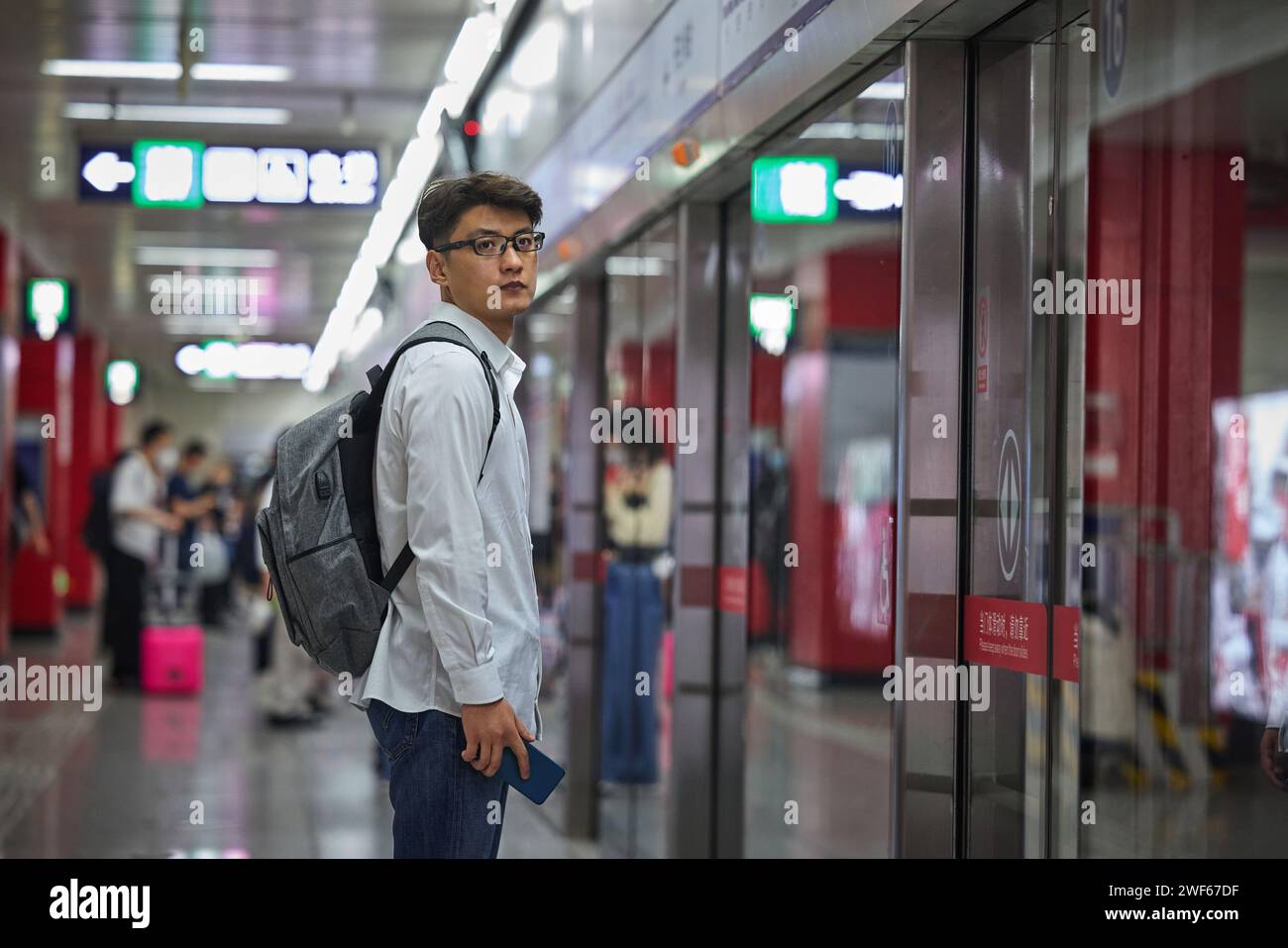 Back of man standing on a platform hi-res stock photography and images ...
