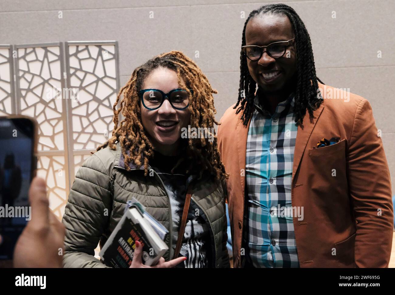Atlanta, Georgia, USA. 28th Jan, 2024. Author and anti-racist scholar Ibram X Kendi poses for a photo with an attendee at an event in Atlanta where Kendi shared the release of his new book ''Barracoon'', which is an adaptation of Zora Neale Hurston's book of the same title. Kendi's adaptation contain's language that caters to younger readers. (Credit Image: © John Arthur Brown/ZUMA Press Wire) EDITORIAL USAGE ONLY! Not for Commercial USAGE! Credit: ZUMA Press, Inc./Alamy Live News Stock Photo