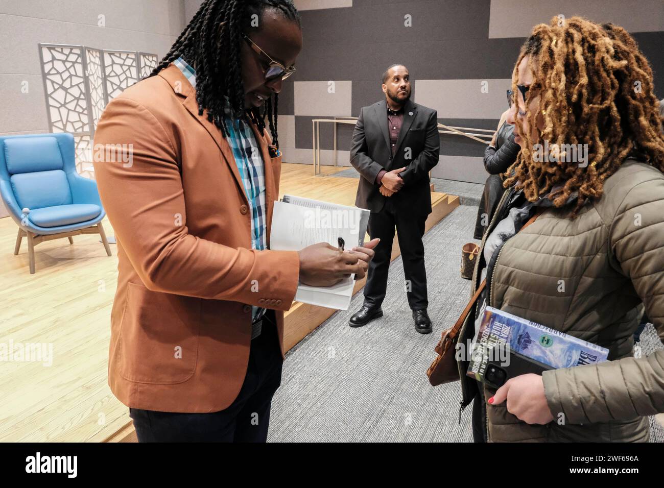 Atlanta, Georgia, USA. 28th Jan, 2024. Author and anti-racist scholar Ibram X Kendi signs one of his books an attendee at an event in Atlanta where Kendi shared the release of his new book ''Barracoon'', which is an adaptation of Zora Neale Hurston's book of the same title. Kendi's adaptation contain's language that caters to younger readers. (Credit Image: © John Arthur Brown/ZUMA Press Wire) EDITORIAL USAGE ONLY! Not for Commercial USAGE! Credit: ZUMA Press, Inc./Alamy Live News Stock Photo