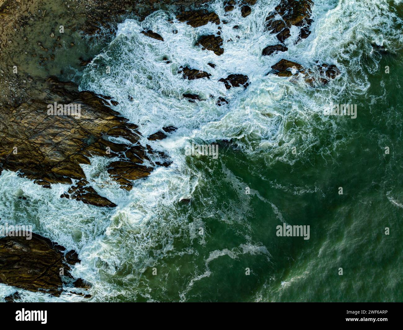 Bird eye view seashore with big wave crashing on rock cliff. Beautiful ...