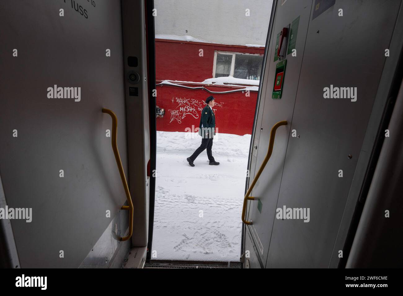 A supervisor is seen walking along one of the platforms at Gelio station during a train ride from Oslo to Bergen. The Bergen train route, known as Bergensbanen, is a rail experience that offers travelers a scenic journey through Norway's most breathtaking landscapes. The rail line provides a connection to the Nordic wilderness as the train crosses high plateaus, fjords, crosses rivers and offers breathtaking panoramas. The trains offer on-board amenities, including restaurant cars where passengers can enjoy Norwegian food and drinks while watching the scenery pass by. (Photo by Jorge Castella Stock Photo