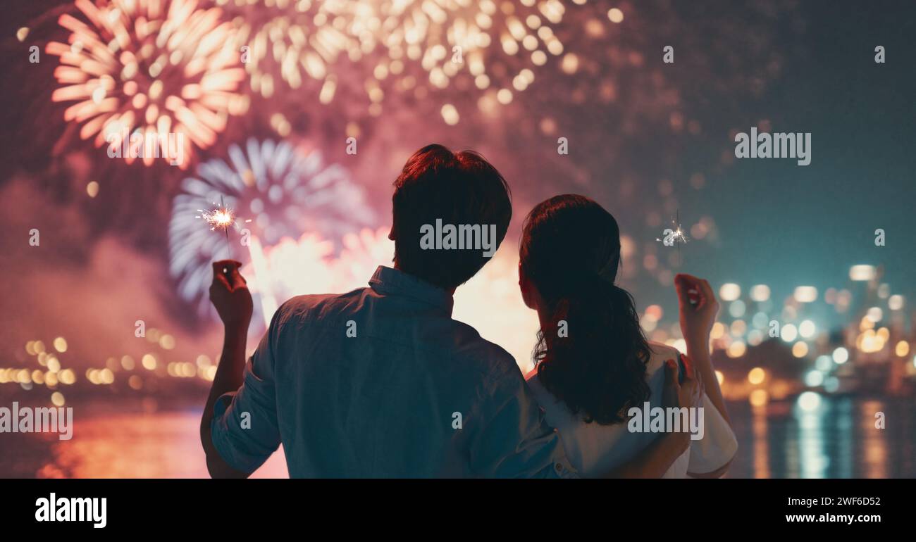 Happy loving couple watching fireworks. Stock Photo