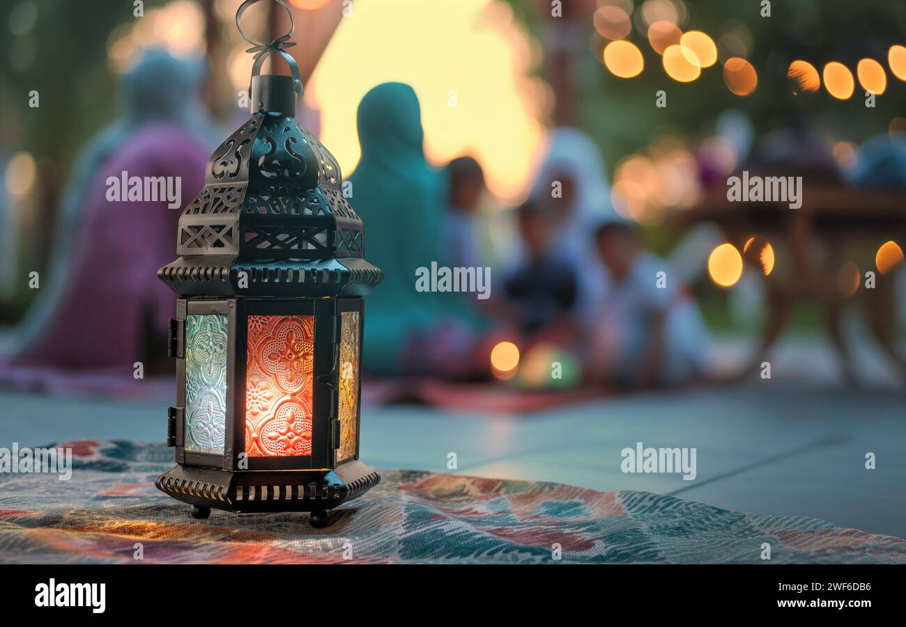 Ornamental Arabic lantern with burning candle glowing. Festive greeting card, invitation for Muslim holy month Ramadan Kareem. Stock Photo