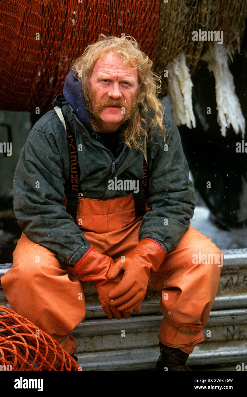 fisherman Mel A. White of the commercial fishing vessel Miss Amy at dock in Akutan, Alaska, on the Aleutian Chain, Bering Sea Stock Photo