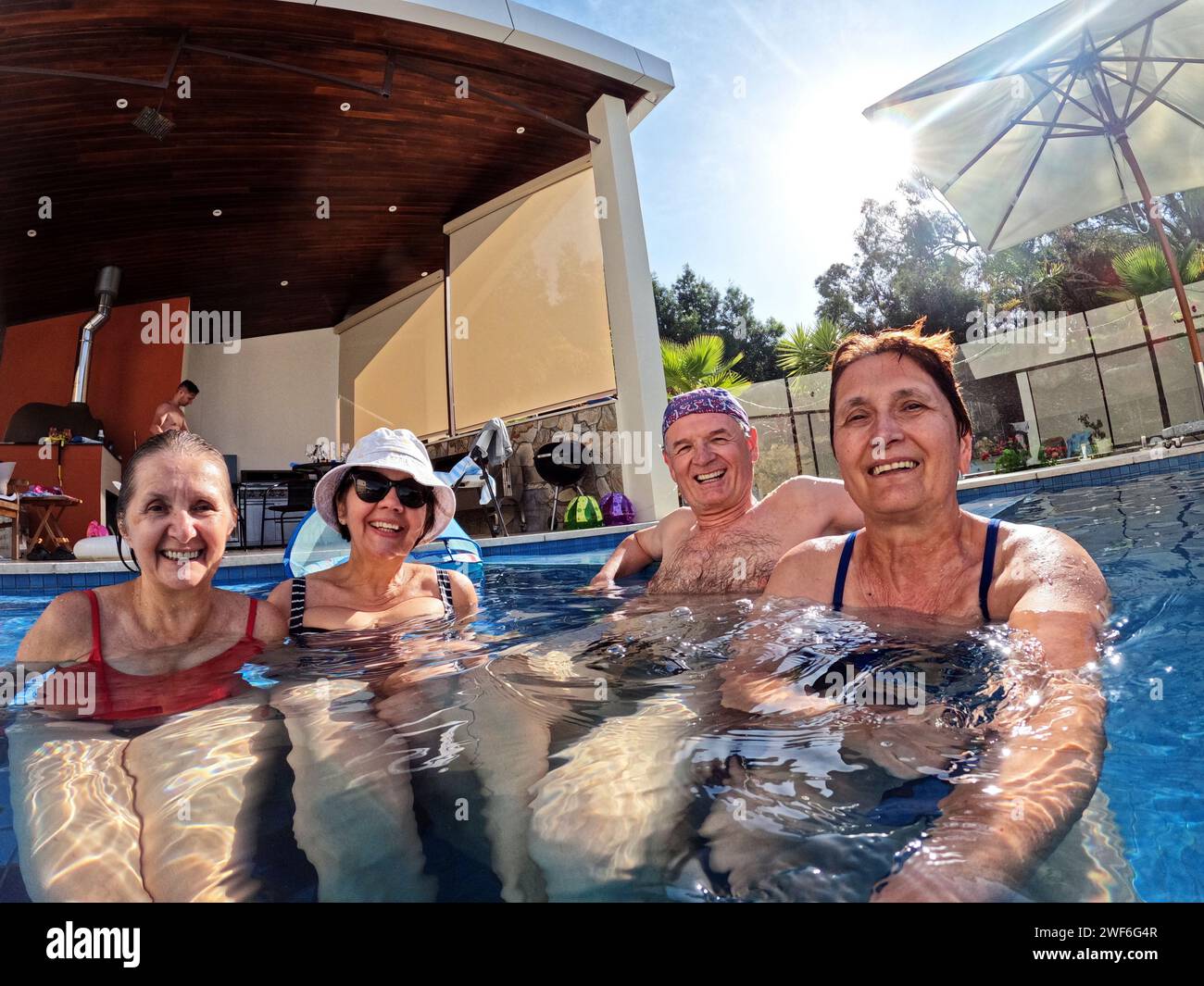 Group of senior people enjoying in the swimming pool Stock Photo