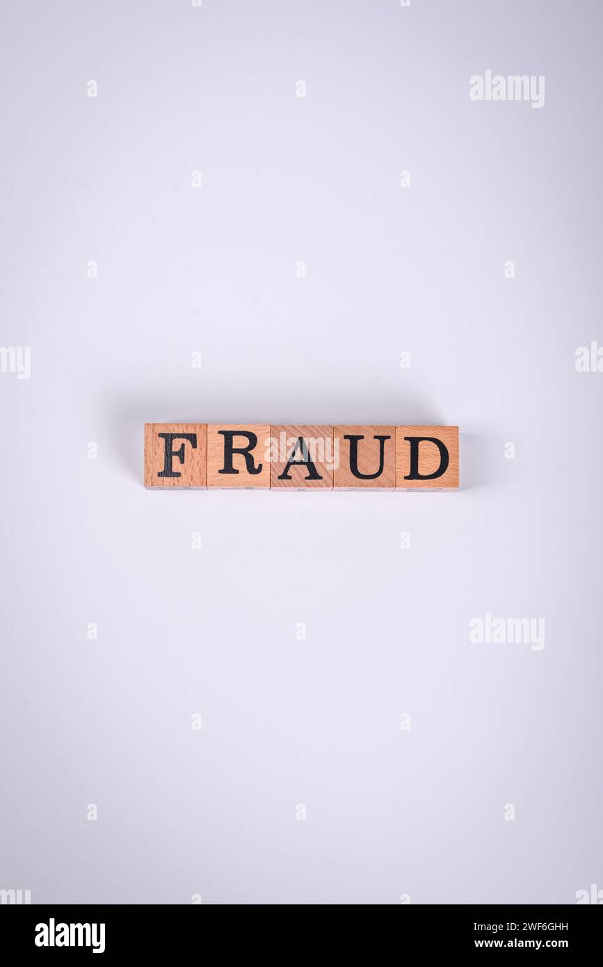 The inscription Fraud inspection made of wooden cubes on a plain ...