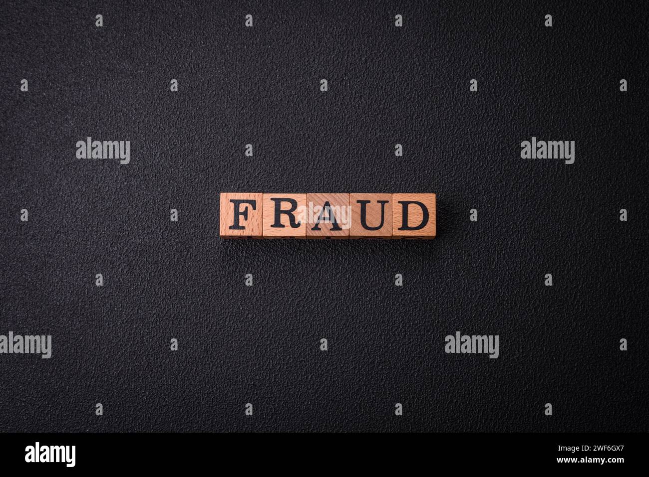 The inscription Fraud inspection made of wooden cubes on a plain ...