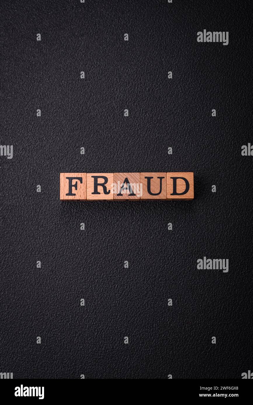 The inscription Fraud inspection made of wooden cubes on a plain ...