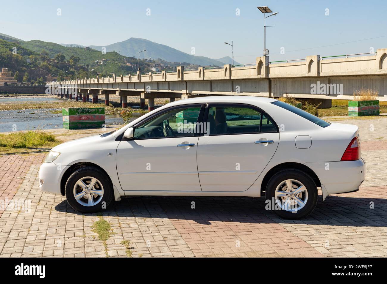 White toyota corolla car side view: Swat, Pakistan - 10 October 2023. Stock Photo