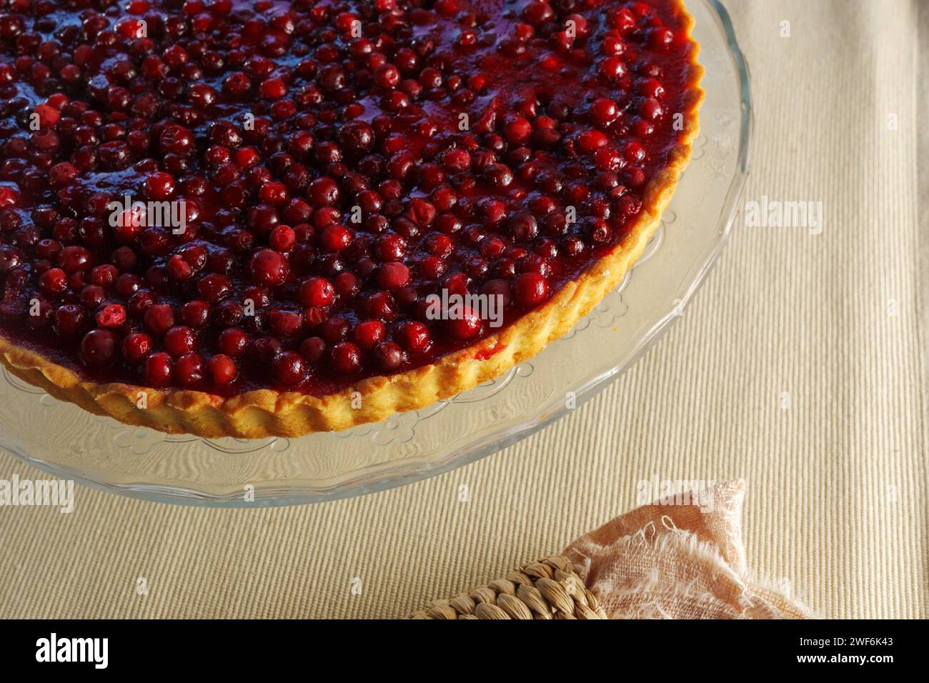 Gleaming Gastronomy: A Luscious Pie Gracefully Resting on a Delicate Glass Plate Stock Photo