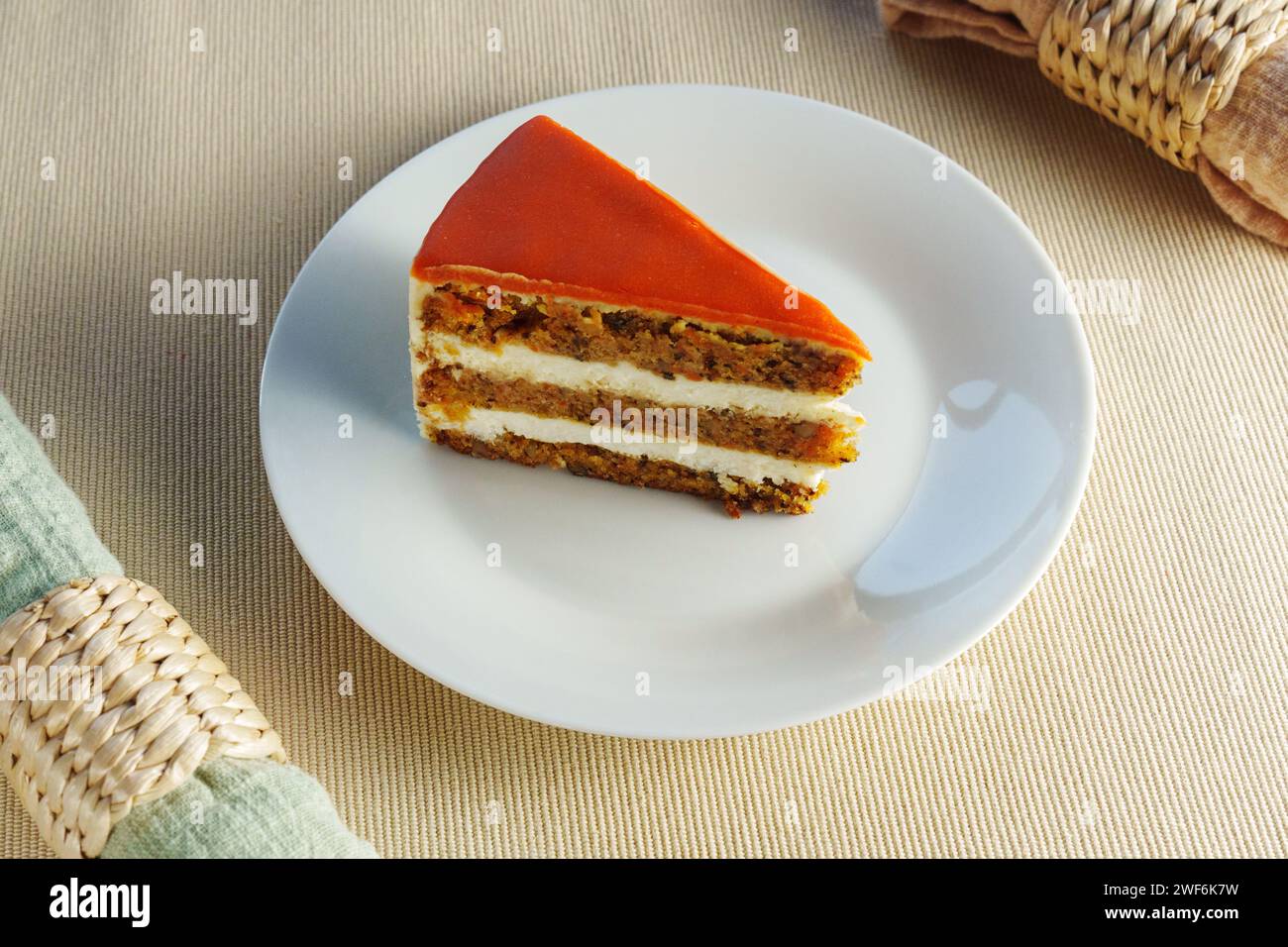 Deliciously Moist Carrot Cake Served on a Clean, White Plate Stock Photo