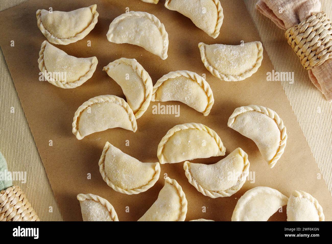 Variety of beautifully crafted dumplings artfully assembled on a wooden cutting board Stock Photo