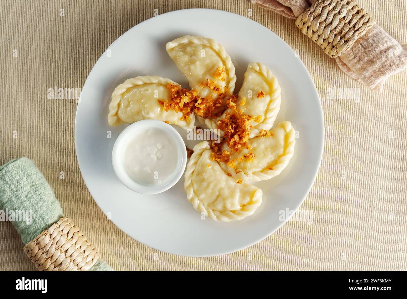 Delicate Pleasures: A Luxurious Feast of Dumplings and Exquisite Dip Stock Photo