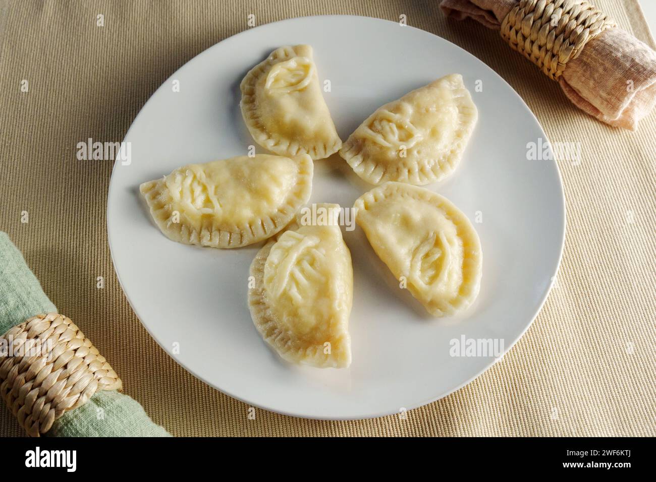 Delectable Crescent Dumplings on a Plate: A Culinary Snapshot Stock Photo