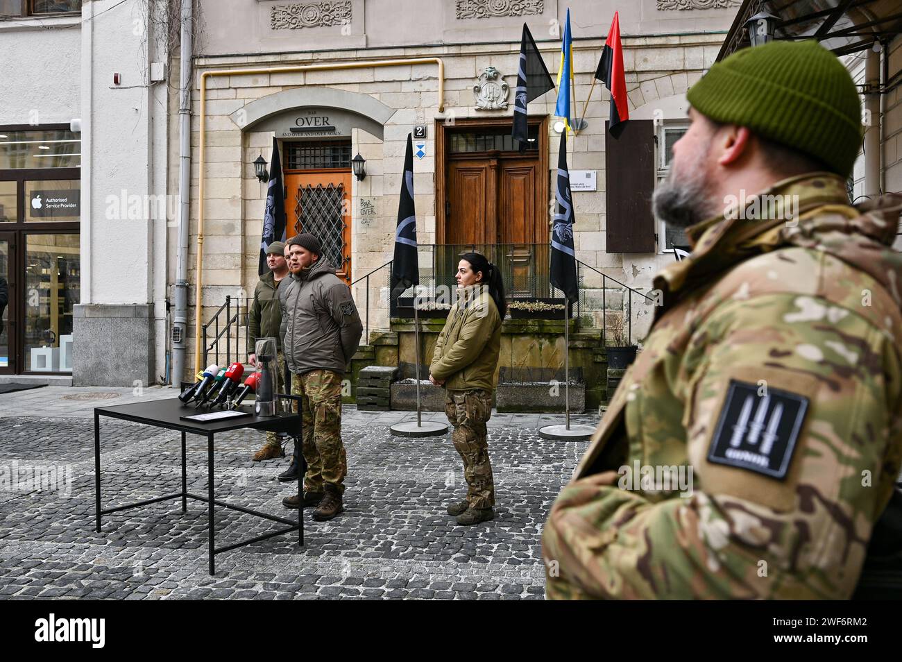 LVIV, UKRAINE - JANUARY 26, 2024 - Head of Ulf Medical Service Alina Mykhailova and Deputy Chief of Intelligence of the Da Vinci Wolves battalion Serhii Filimonov (R to L) are pictured during the opening ceremony of the first recruiting center of the 1st separate battalion 'Da Vinci Wolves' named after Dmytro Kotsiubailo in Lviv, western Ukraine. Stock Photo