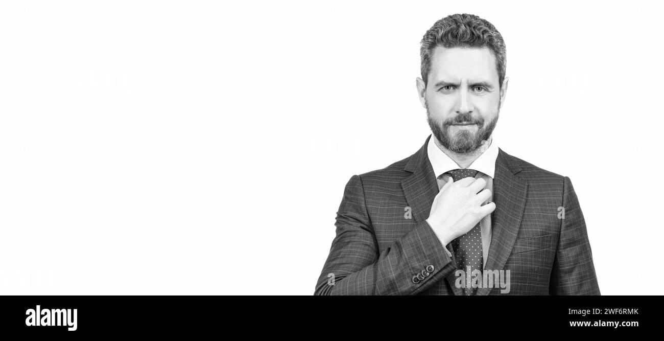 Middleaged manager fix necktie wearing elegant blue suit in formal