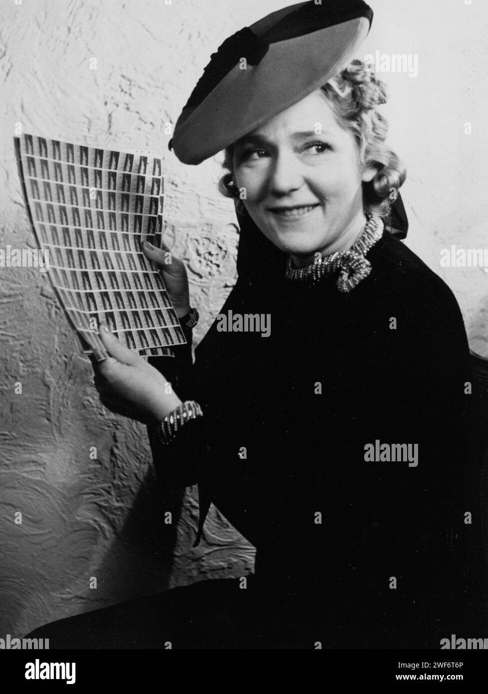 Hollywood actress Mary Pickford, a strong supporter of women's rights, buys the first sheet of equal rights seals Stock Photo
