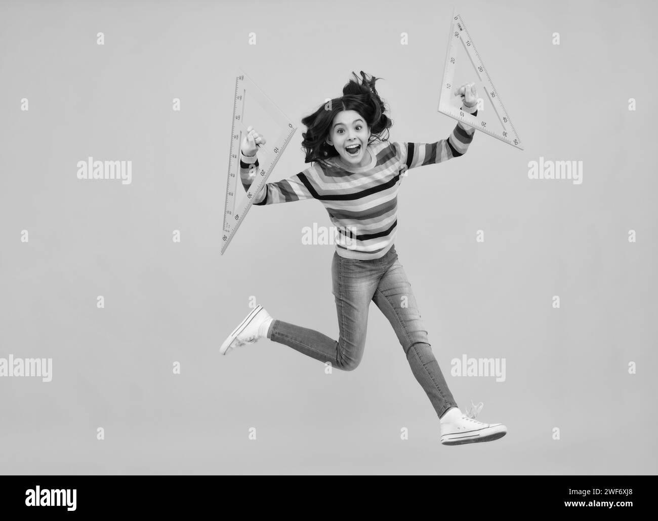 Amazed teenager. Teenager child school girl holding measure for