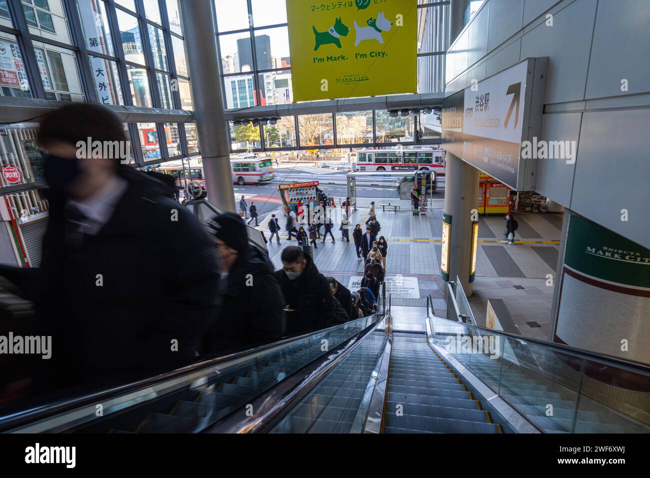 Tokyo, Japan. January 9, 2024.  people going up an escalator in a shopping center in the city center Stock Photo