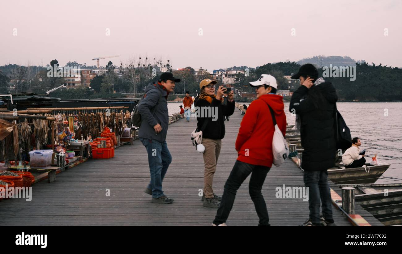 A group of friends on the ancient pontoon bridge in Ganzhou, Jiangxi province Stock Photo