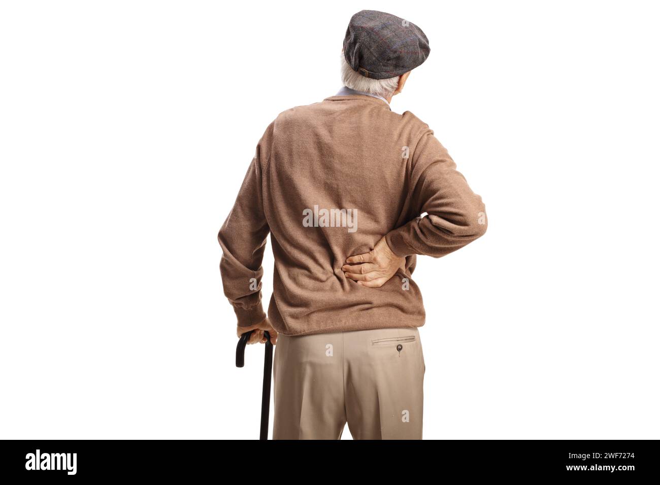 Rear view shot of an older man with a cane holding his stiff back ...