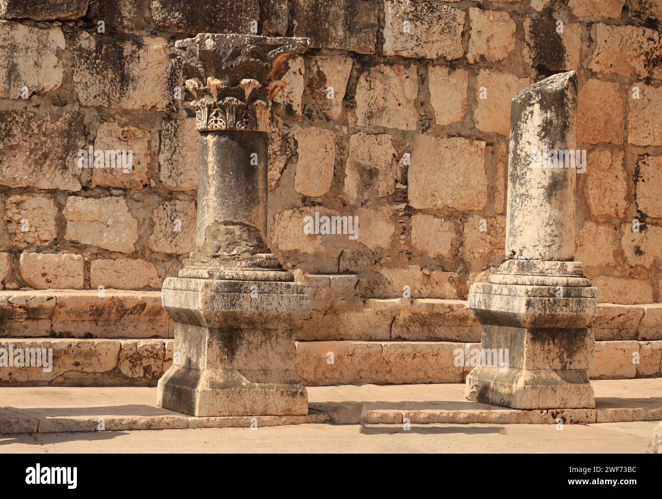 Two columns of an ancient colonnade of a basilica in Capernaum show a Corinthian capital Stock Photo