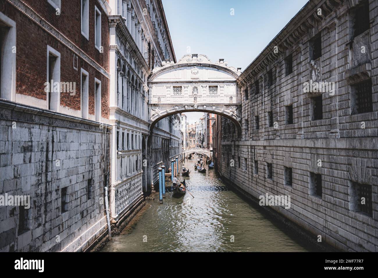 Gondolas glide beneath the historic Bridge of Sighs, one of Venice's