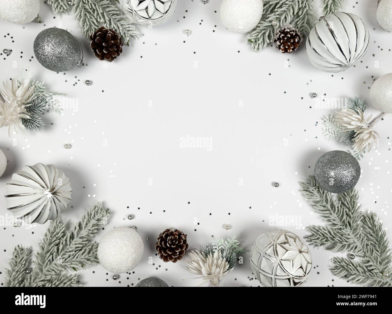 Christmas composition, white and silver decorations, fir tree branches ...