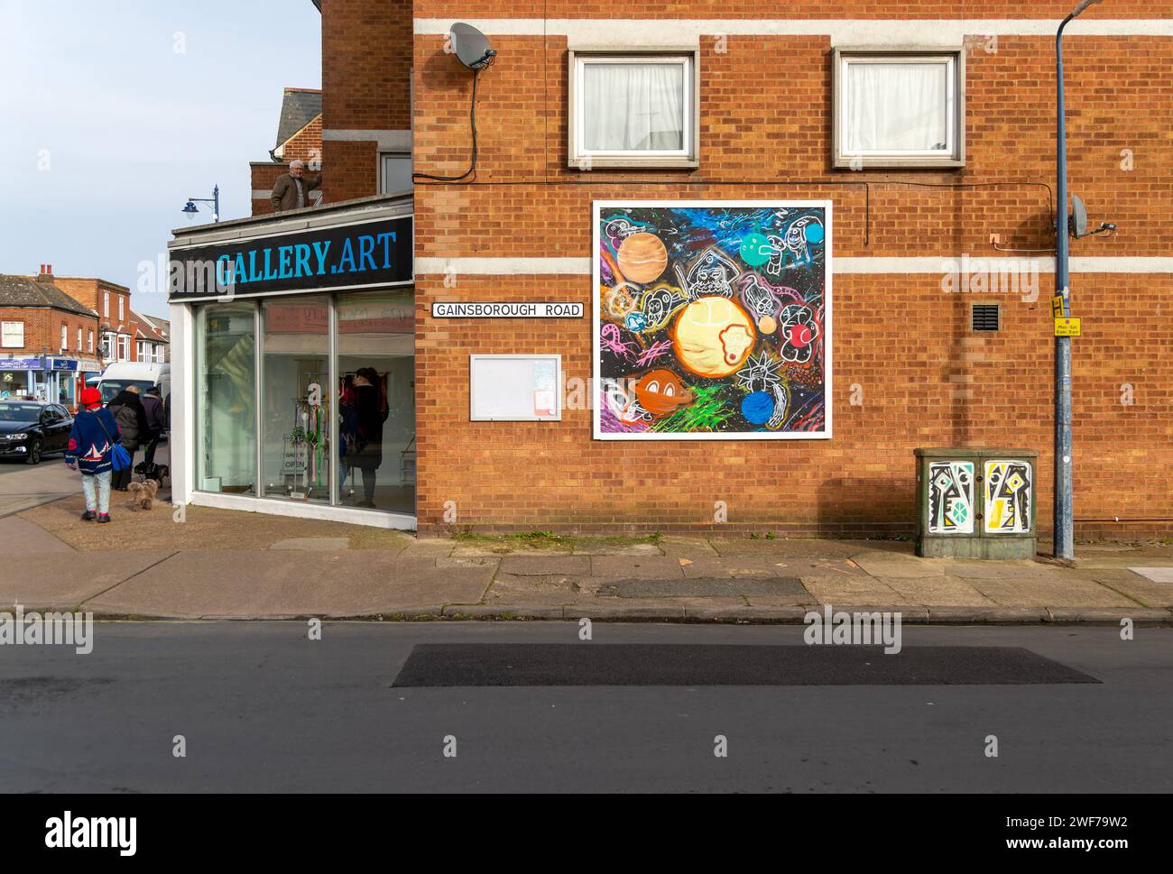 Street art painting on wall outside gallery shop, Felixstowe, Suffolk, England, UK Stock Photo