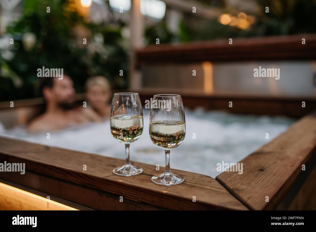 Couple in hot tub wine hi-res stock photography and images - Alamy