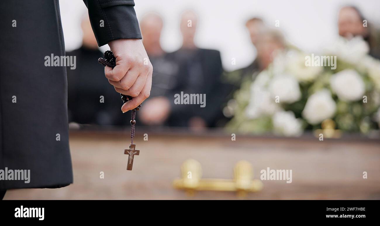 Funeral, religion and hands with rosary for memorial service, death