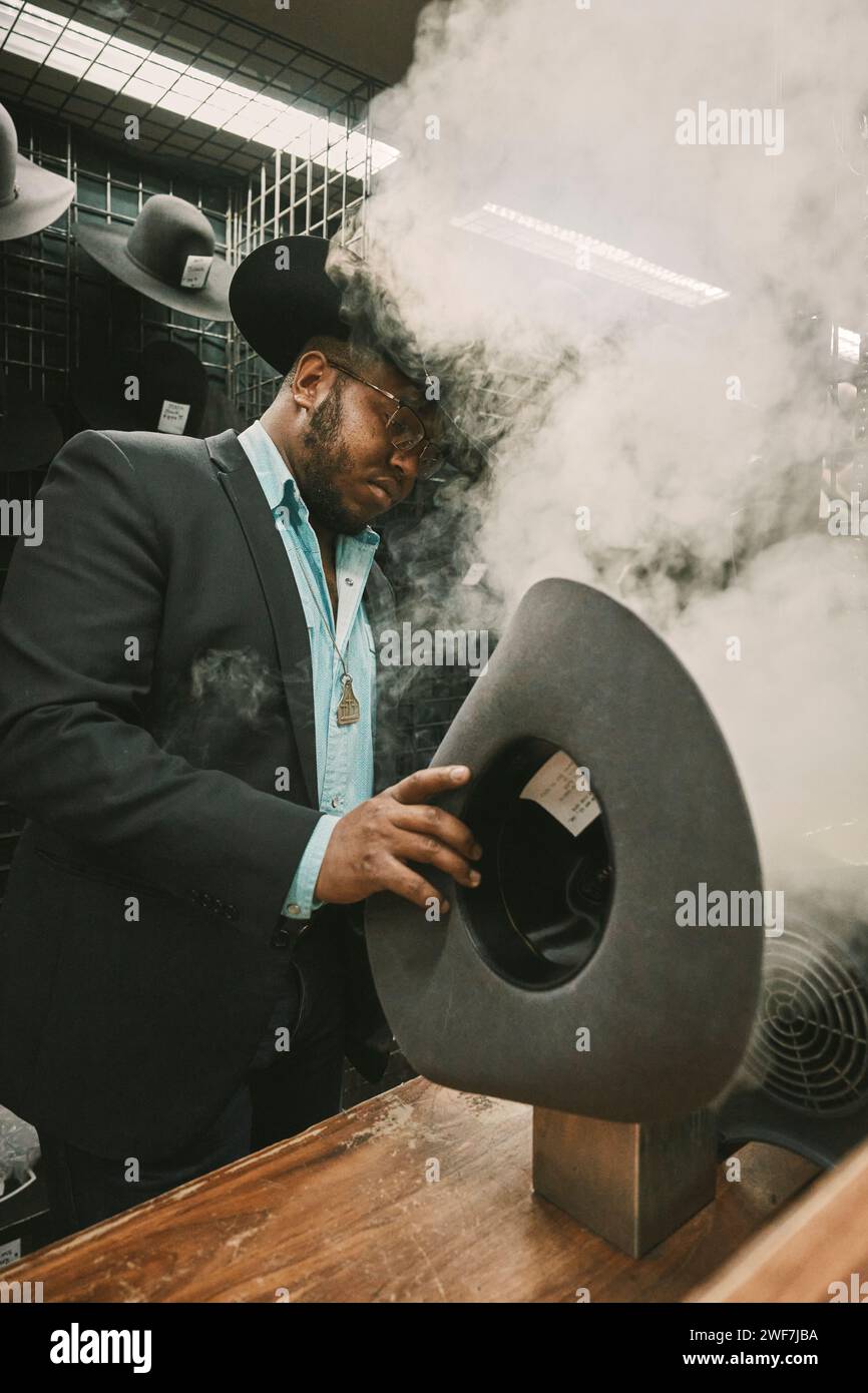 man-shaping-cowboy-hat-at-rodeo-using-steam-stock-photo-alamy