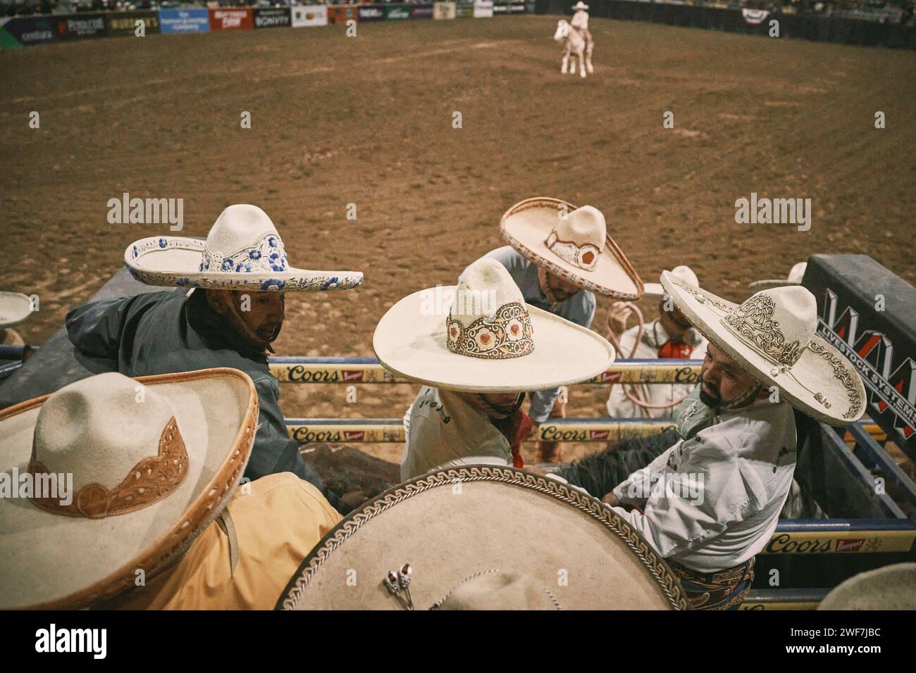 Mexican cowboys in bullpen during rodeo Stock Photo