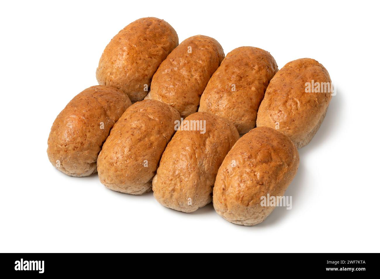 Row of of brown whole grain buns of bread close up isolated on white background Stock Photo