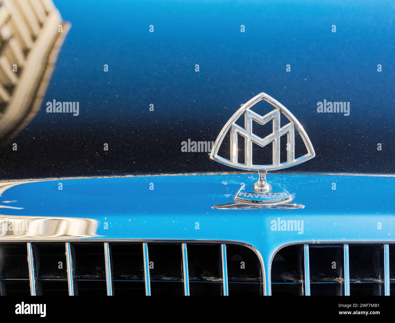 uzhgorod, ukraine - 31 oct 2021: close-up of a maybach limousine mascot on the hood with blurred cityscape architecture reflection Stock Photo