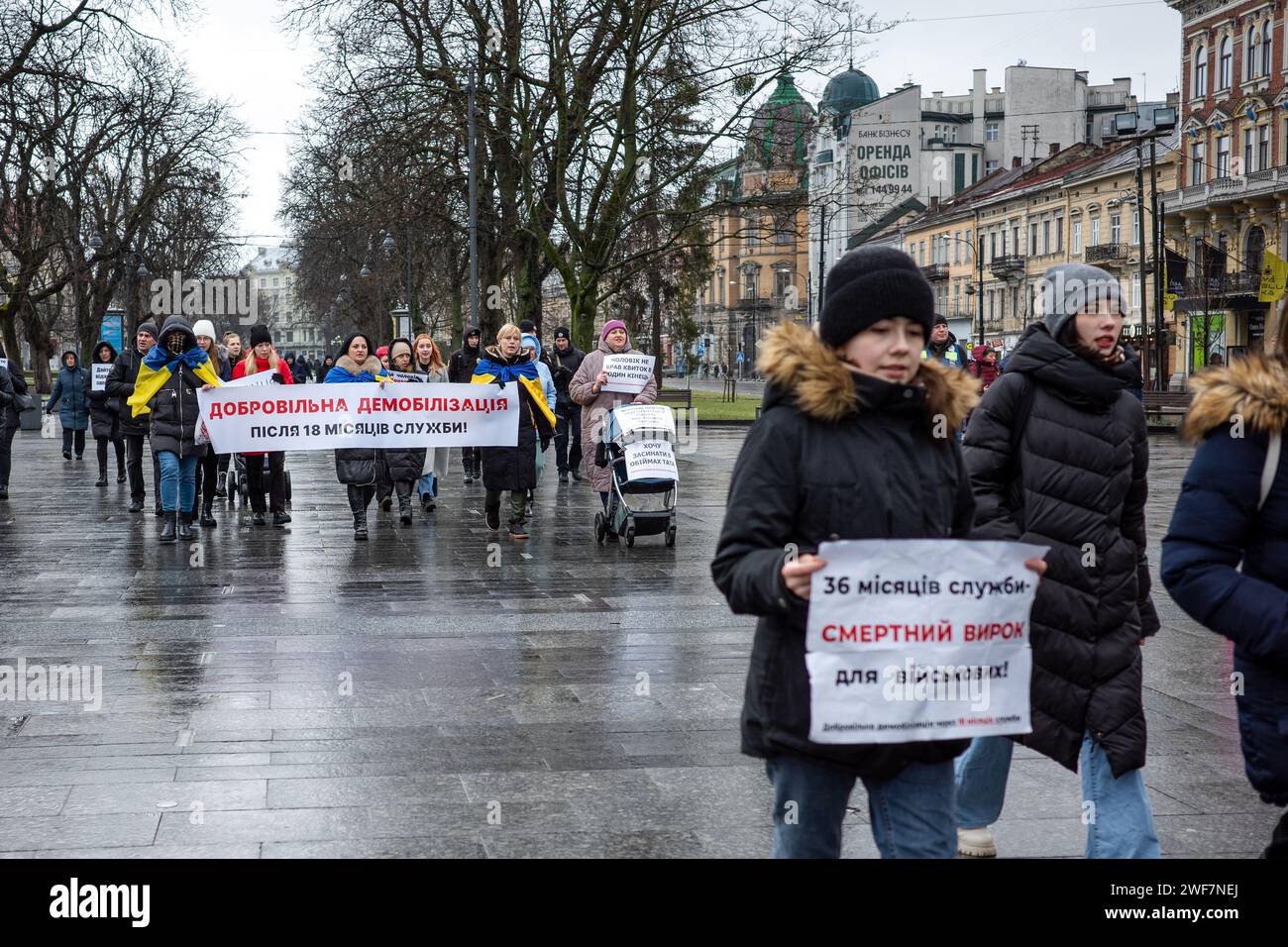 LVIV, UKRAINE - JANUARY 28, 2024 - Participants of a picket by military relatives demand the demobilization of soldiers after 18 months of service as they walk down the street, Lviv, western Ukraine. Stock Photo