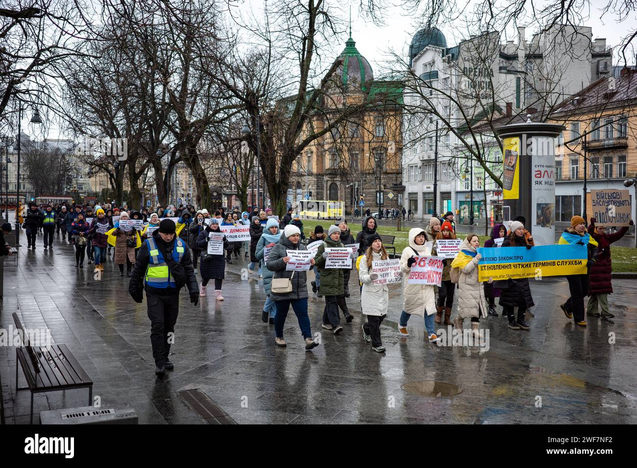 LVIV, UKRAINE - JANUARY 28, 2024 - Participants of a picket by military relatives demand the demobilization of soldiers after 18 months of service as they walk down the street, Lviv, western Ukraine. Stock Photo
