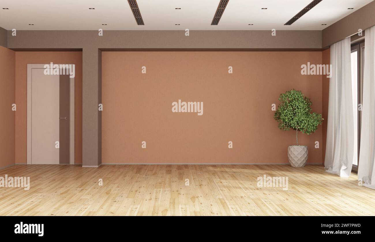 Empty living room with brown and peach fuzz walls ,closed door, houseplant and window Stock Photo