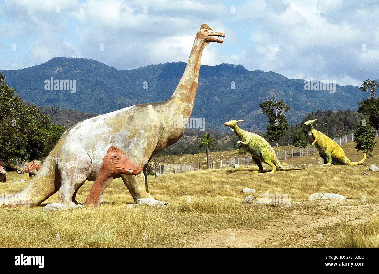 Giant concrete dinosaurs populate a valley in Baconao Park near Santiago de Cuba. Stock Photo