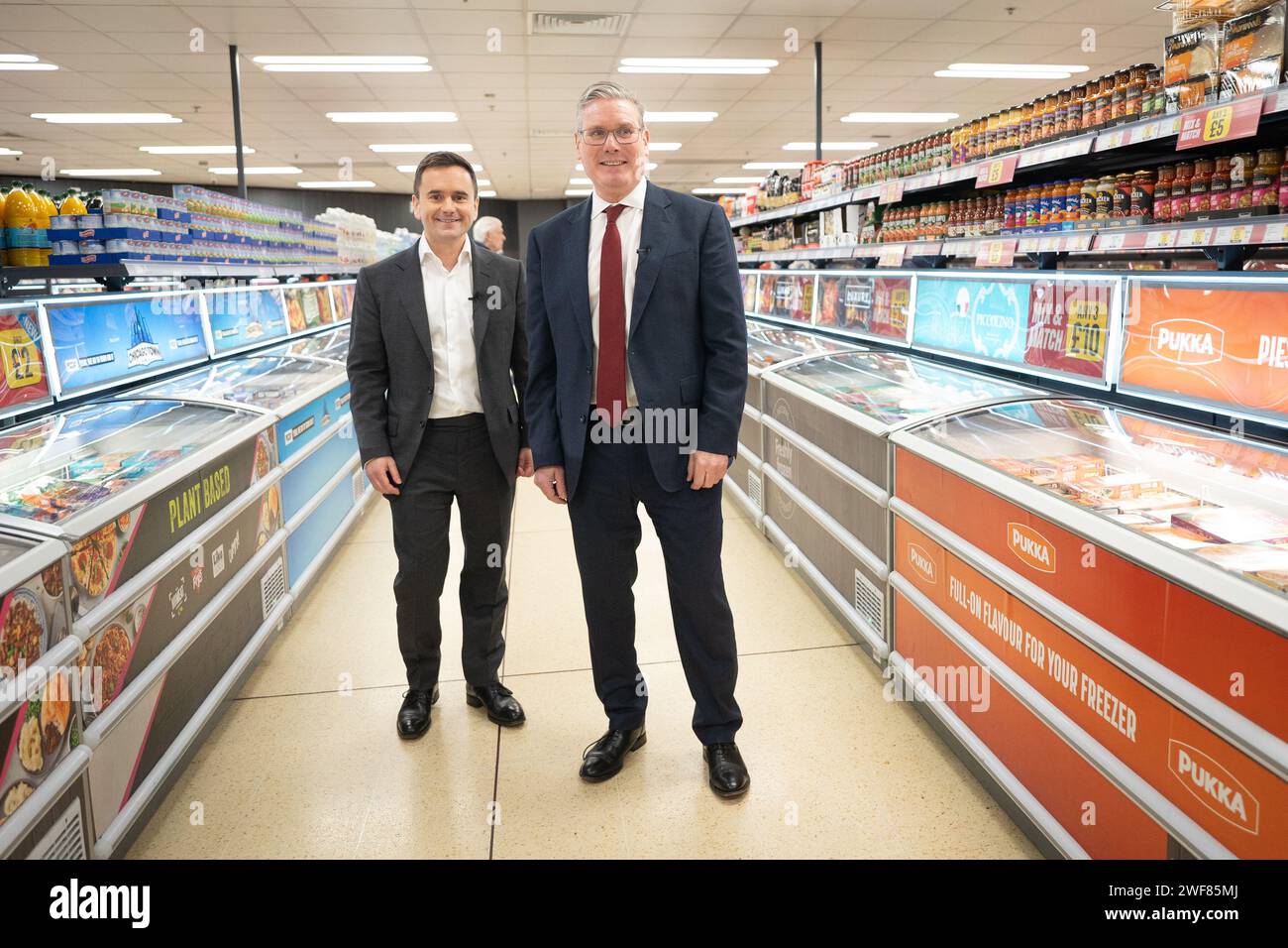 Labour leader Sir Keir Starmer (right) tours an Iceland supermarket in Warrington with executive chairman of the food chain, Richard Walker (left). Mr Walker has given his backing to Labour, saying the party was the 'right choice' for business and voters. Picture date: Monday January 29, 2024. Stock Photo