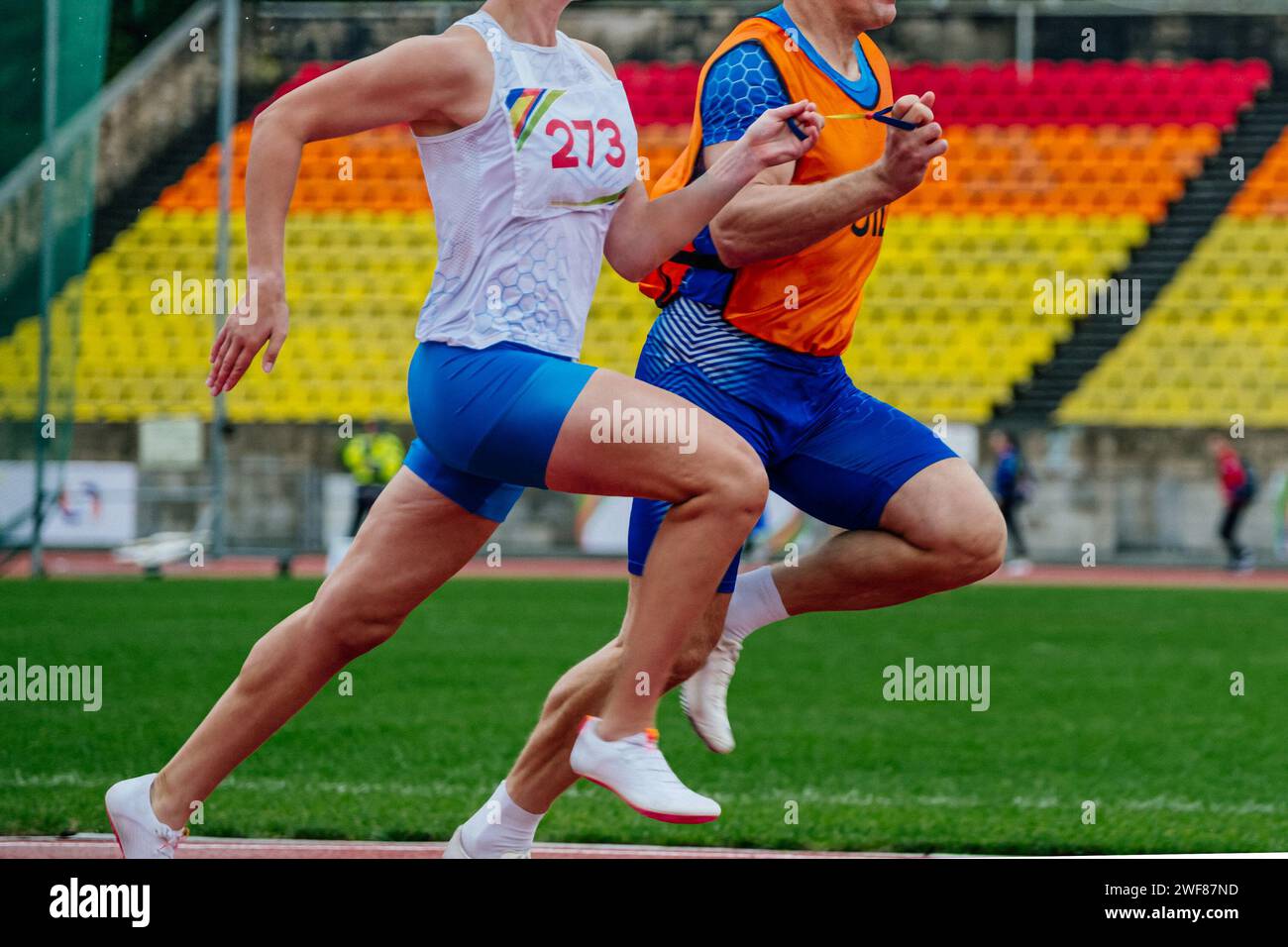 blind male athlete runner with guide running race, summer para athletics championships Stock Photo