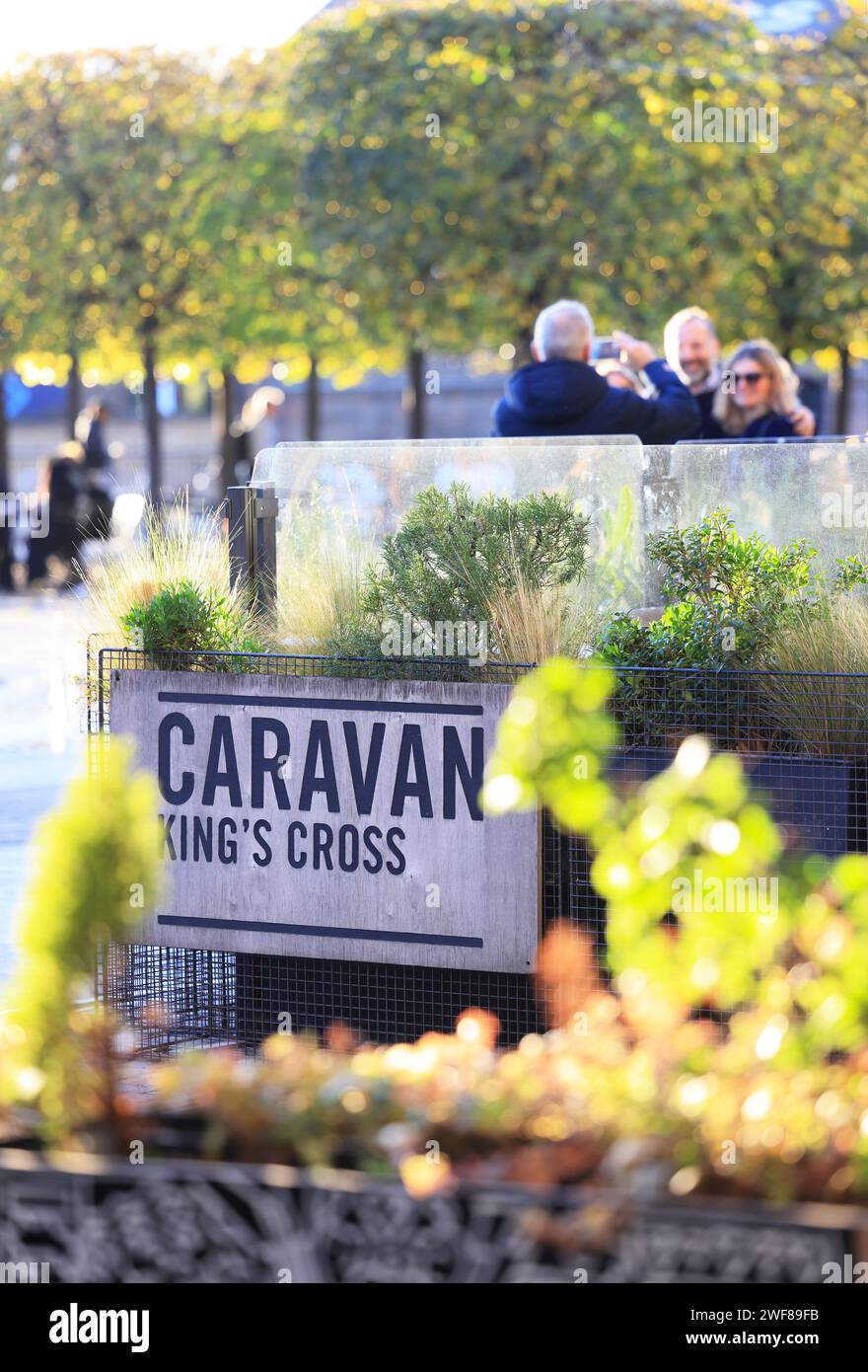 Trendy Caravan restaurant in winter sunshine on Granary Square, at Kings Cross, north London, UK Stock Photo