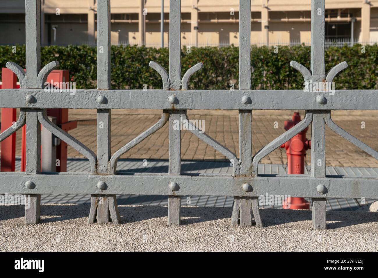 wrought iron railing, old factory gate with allegorical elements fixed