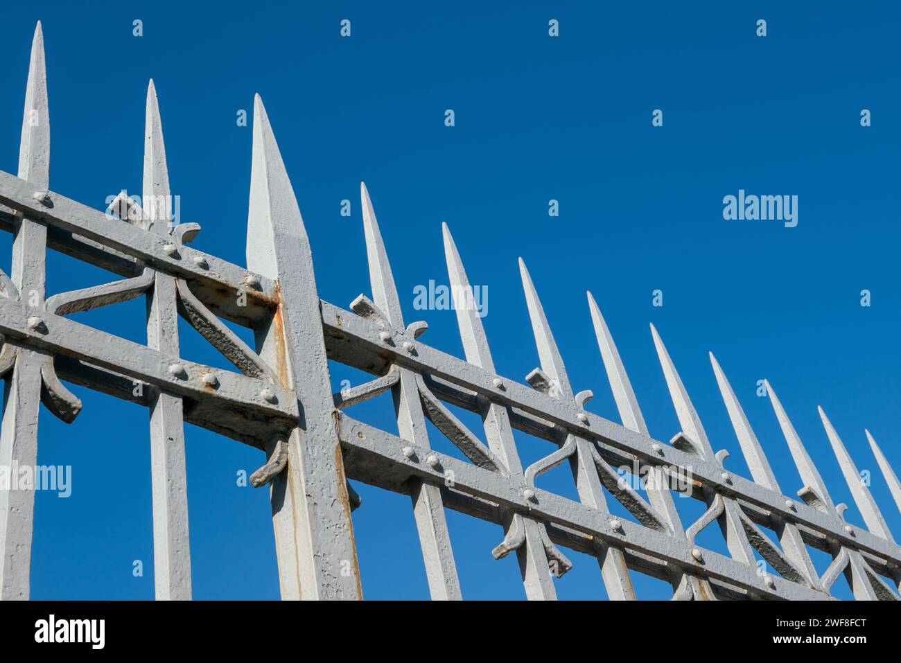 wrought iron railing, old factory gate with allegorical elements fixed