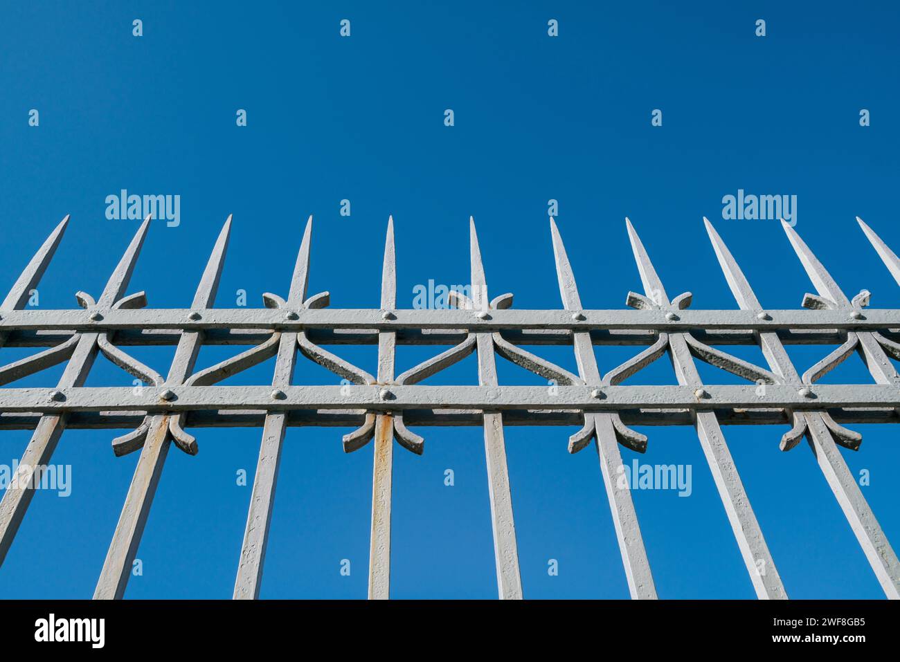 wrought iron railing, old factory gate with allegorical elements fixed