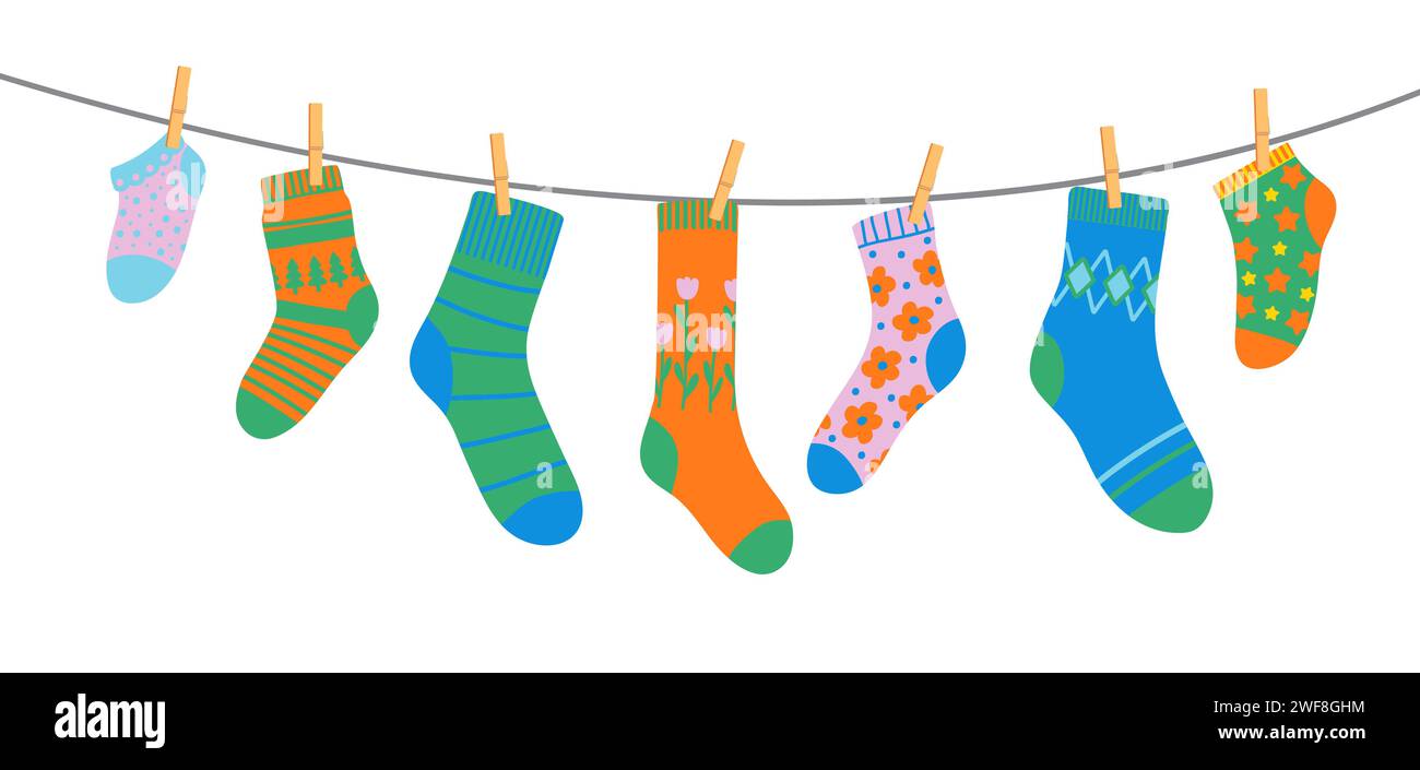 Cotton and wool socks on clothesline, socks on rope with clothespins