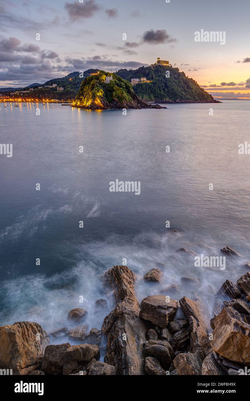 The bay of San Sebastian in Spain with the Monte Igueldo after sunset Stock Photo
