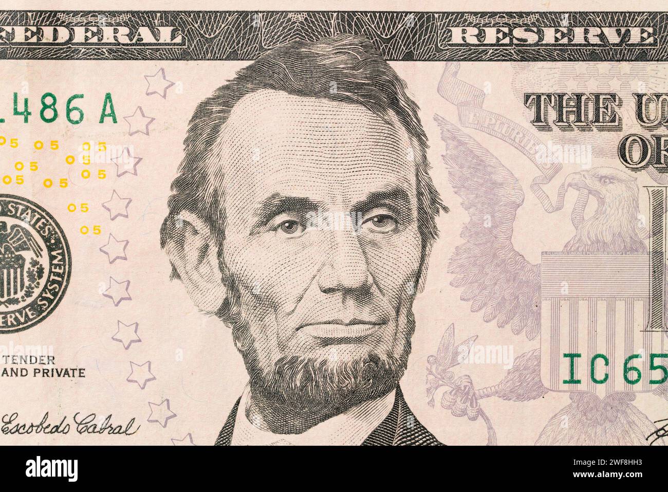 US President Abraham Abe Lincoln on USA five dollar bill extreme macro, 5 usd, United States of America money closeup Stock Photo