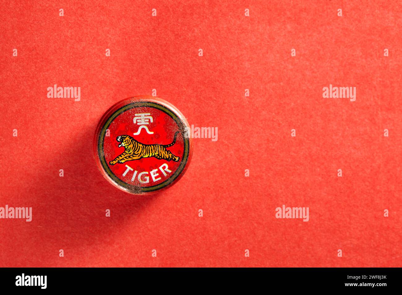 The back view of an old can of traditional Chinese balm medicine with a picture of a tiger Stock Photo