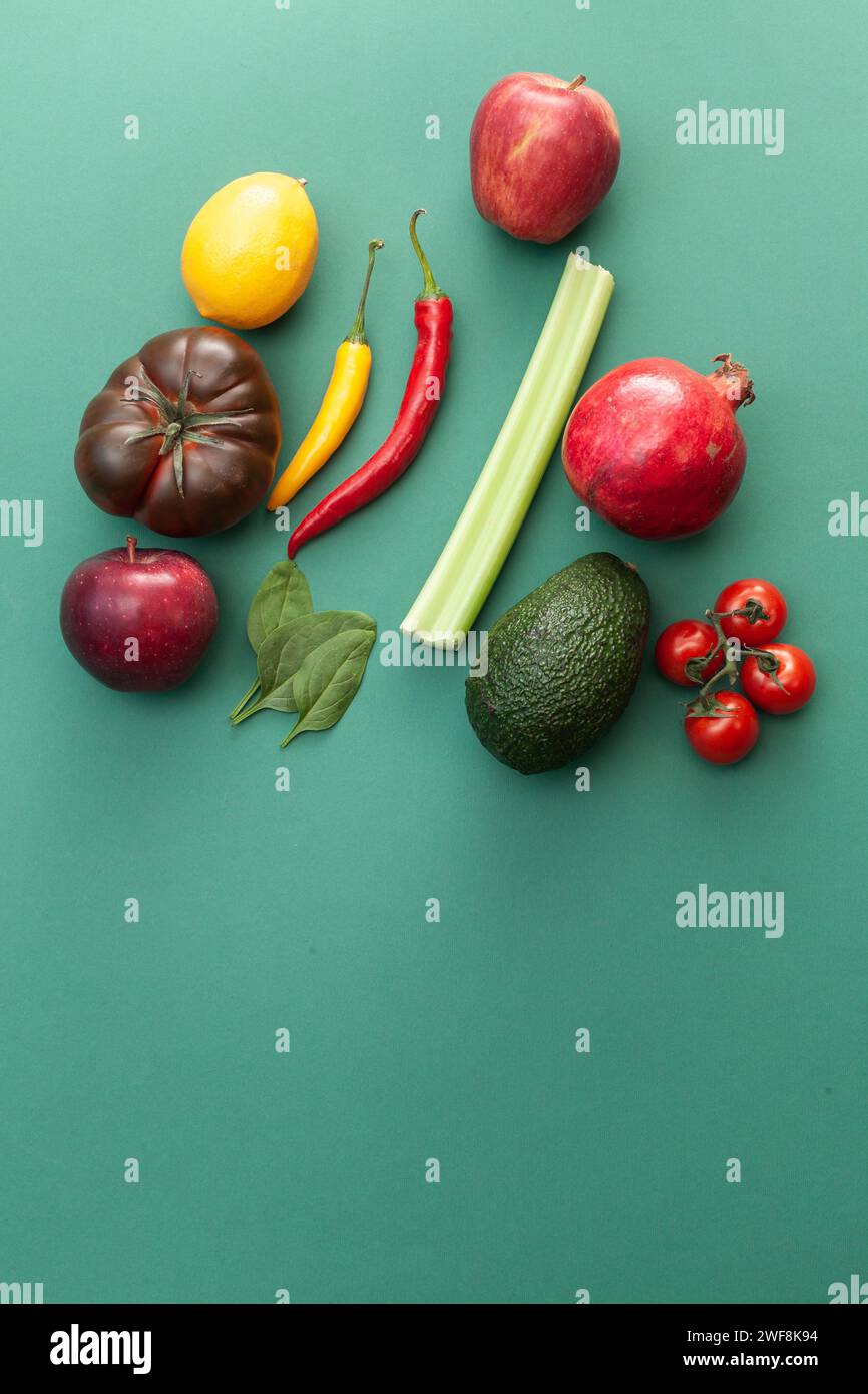 fruits and vegetables on green background Stock Photo - Alamy